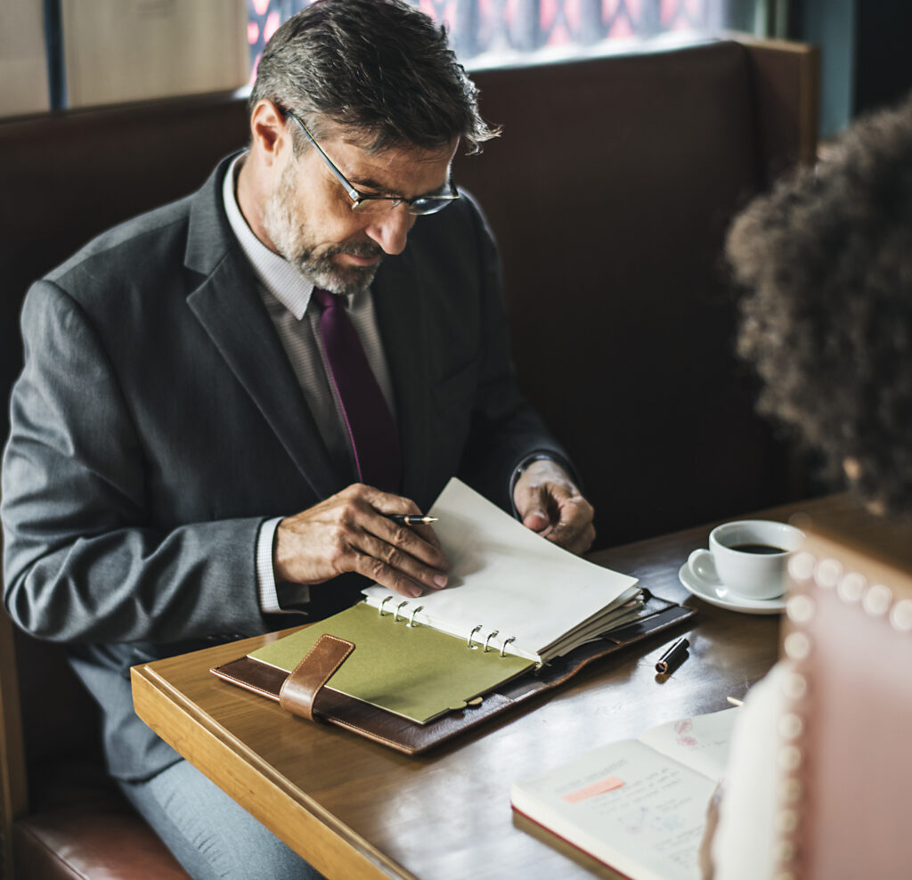 business people discussing cafe