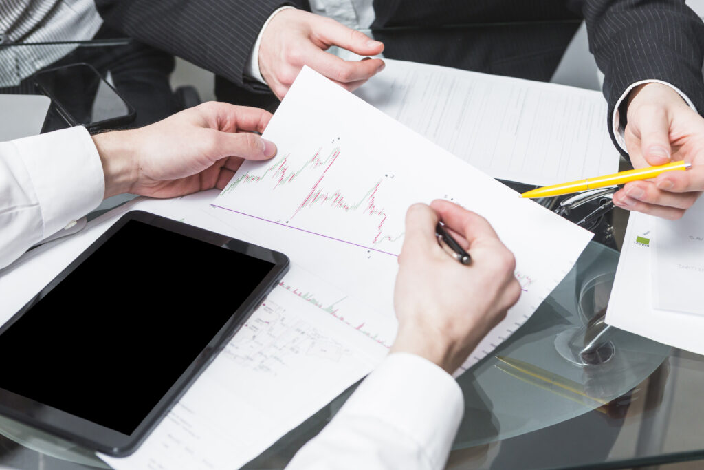 close up two businesspeople analyzing report office